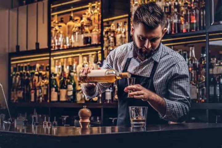 How are bartenders paid?
