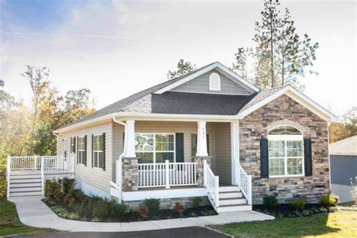 How do you classify a manufactured home as real property?