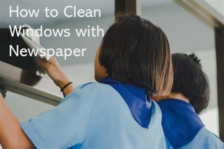 How do you use newspaper to clean windows?