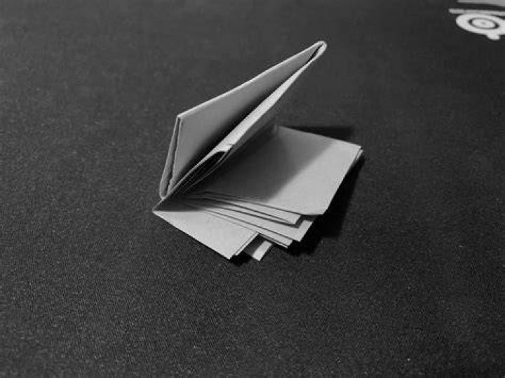 How tall would a piece of paper be if folded 50 times?
