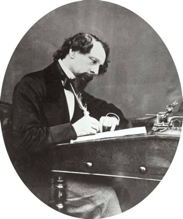 What paper did Charles Dickens work for?
