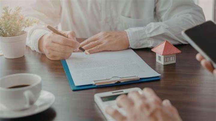 Who administers real estate law in California?